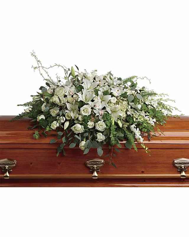 Cream white and ivory casket spray with green foliage